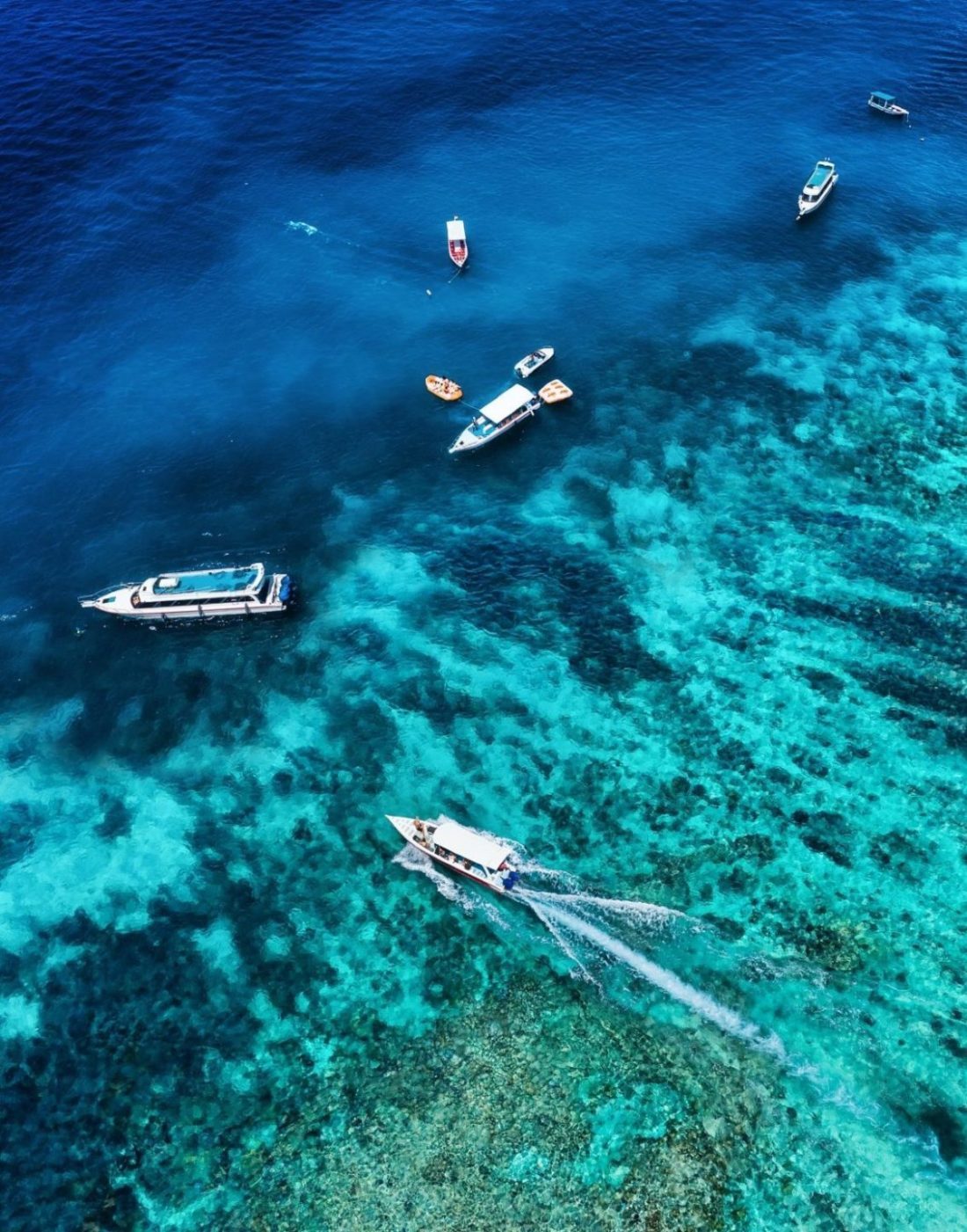 the view from the air on boats near the shore bali island indonesia e1629446906596